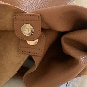 Suede soft and leather soft combo. Light luggage color